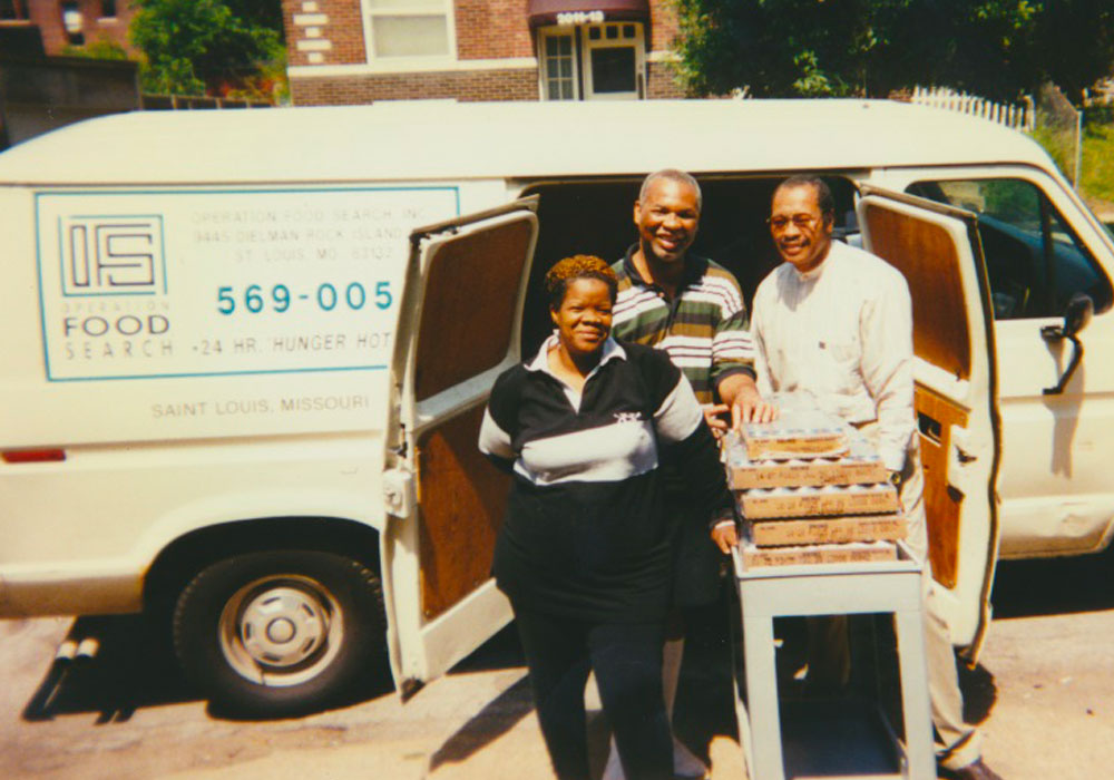 Volunteers posing in front of an Operation Food Search van