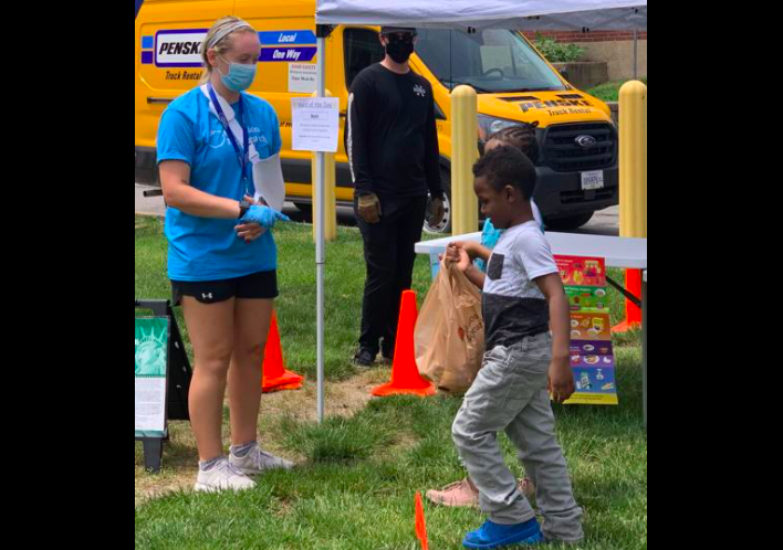 Child donating food