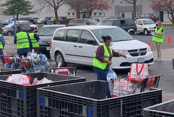 Group of volunteers participating at local food drive