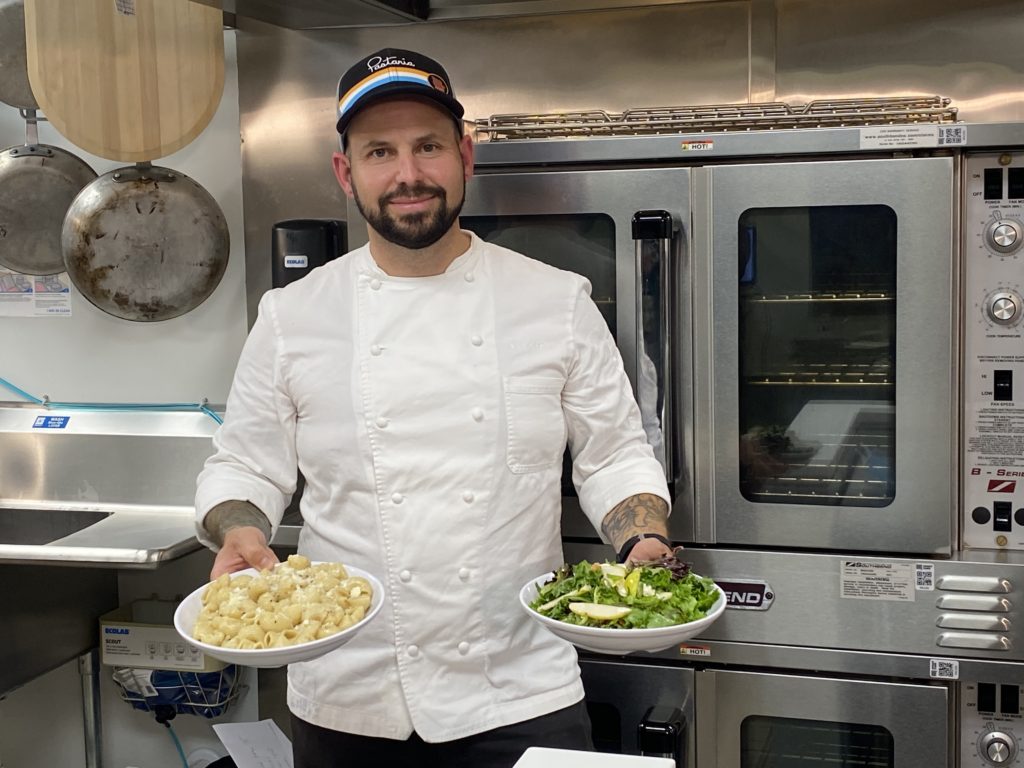 Chef Gerard Craft displays the pasta and salad dishes he created.