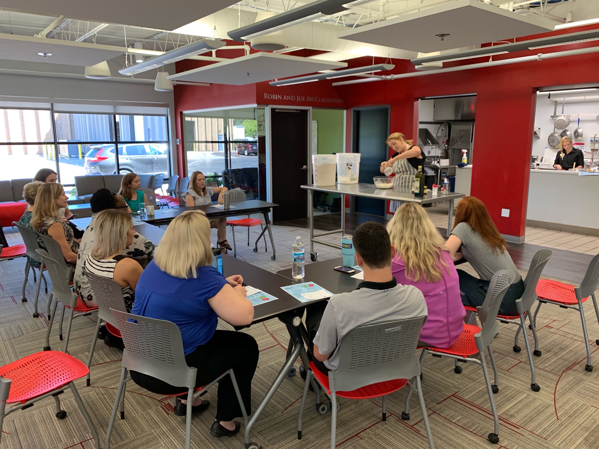 Chef educating volunteers about nutrition