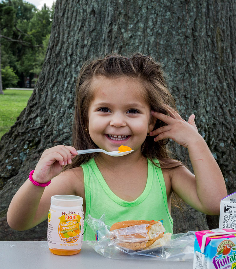 Young girl psoing for a Summer Meals article