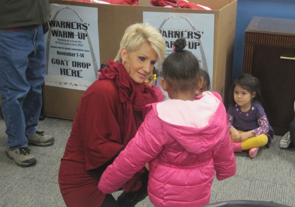 Volunteer talking with children