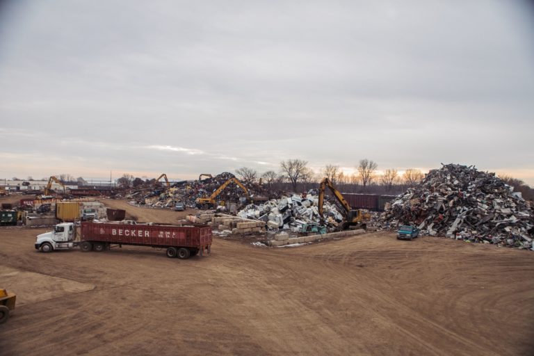 Truck picking up scrap metal