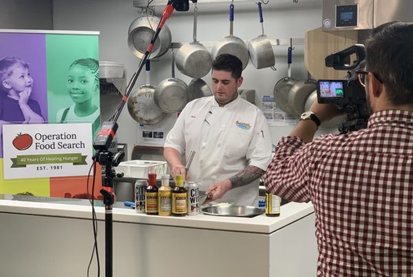 Chef prepares a meal in front of a video camera