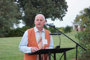 Man speaking at podium at Feast for Change event