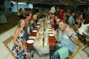 guests seated at dining tables at Feast for Change event