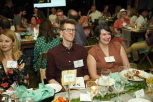 Guests seated at dining table at Feast for Change event