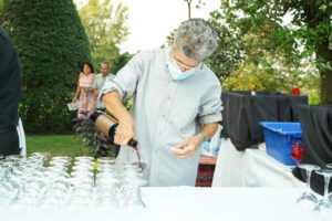 Pouring wine at Feast for Change event