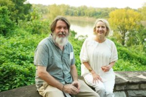 Guests seated in front of Missouri river at Feast for Change event