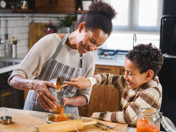 woman and child cooking together