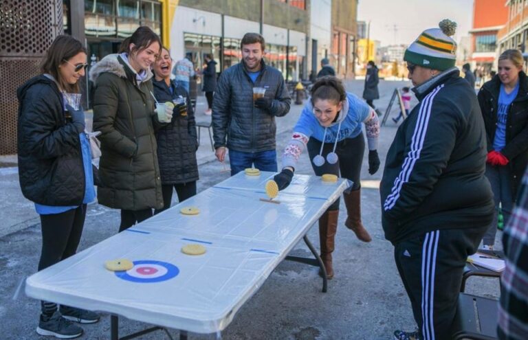 OFS employees playing shuffleboard at winter games celebration